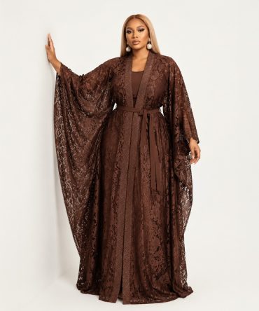 Amber two-piece brown lace dress set featuring a sleeveless pleated maxi inner dress, floral lace outer layer with fabric waist tie and flowing kimono silhouette - TORFEO