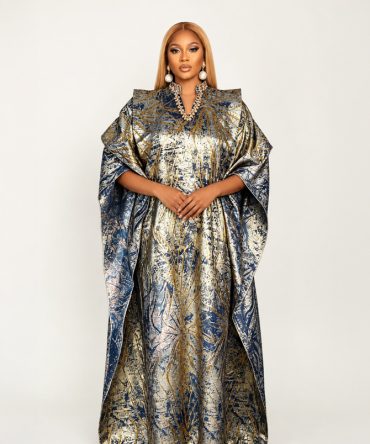 Aurora Royale shimmer brocade kaftan dress in Gold and Navy featuring a flowing maxi silhouette, structured shoulders, embellished neckline and hidden adjustable waist strap - TORFEO