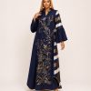 Imperia Luxe Embellished Navy Blue Maxi Dress featuring intricate floral embellishments, striped sleeve and back panels, flowing bell sleeves, and a graceful full-length silhouette for women - TORFEO