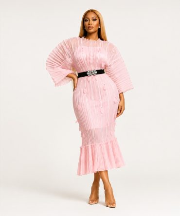 Roselle Bloom blush pink pleated midi dress featuring floral appliqués with gold tone studs, statement pleated sleeves, ruffle hem and black elastic waist belt with floral buckle - TORFEO