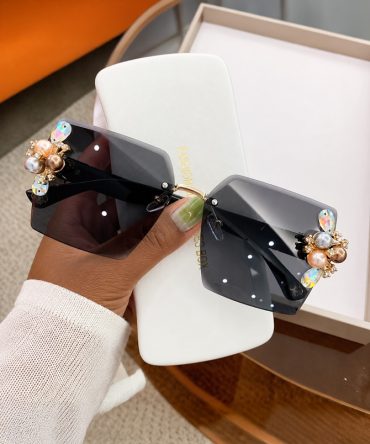 Jeweled Glamour black rimless sunglasses for women with crystal-style embellishments and pearl-like side details - TORFEO