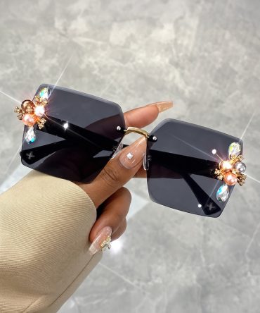 Jeweled Glamour black rimless sunglasses for women with crystal-style embellishments and pearl-like side details - TORFEO