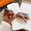 Jeweled Glamour brown rimless sunglasses with orange arm for women with gradient lenses and crystal-style pearl embellishments - TORFEO