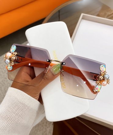 Jeweled Glamour brown rimless sunglasses with orange arm for women with gradient lenses and crystal-style pearl embellishments - TORFEO