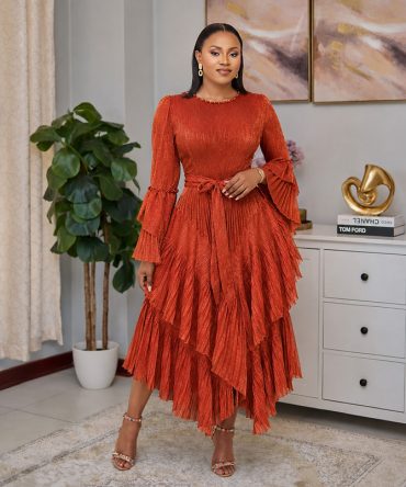 Dusty orange tiered shimmer dress with pleated layers, long sleeves and matching fabric tie belt - TORFEO