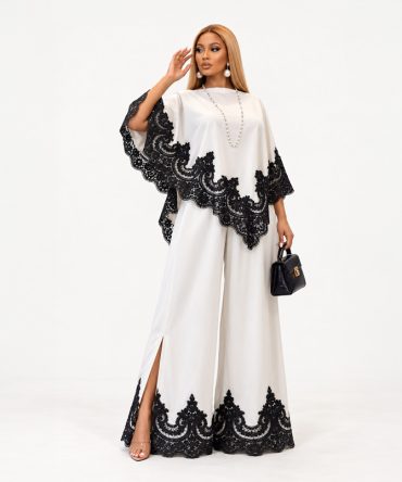 Off-white cape top and floor-length wide-leg trousers two-piece set with black lace trim and side slits - TORFEO