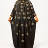 Black and gold embellished Boubou two-piece dress set with gold starburst details and matching inner dress