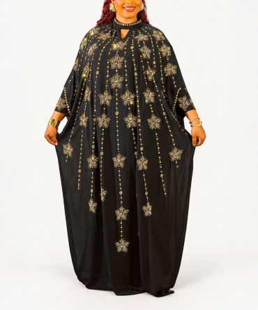 Black and gold embellished Boubou two-piece dress set with gold starburst details and matching inner dress